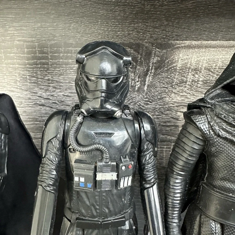 Star Wars action‎ figures Darth Vader, a TIE Fighter Pilot, Kylo Ren, and Finn